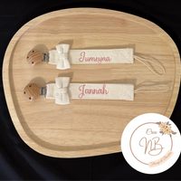 Attache tétine tissu noeud