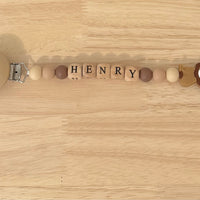 Attache tétine Henry