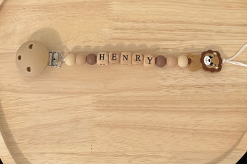 Attache tétine Henry